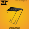 Anvil Aerial Utility Deck attached securely to the rungs of a standard A-frame stepladder, holding an impact driver and hardware in a workshop setting.